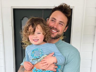 Dylan Efron is carrying Olivia in the picture.